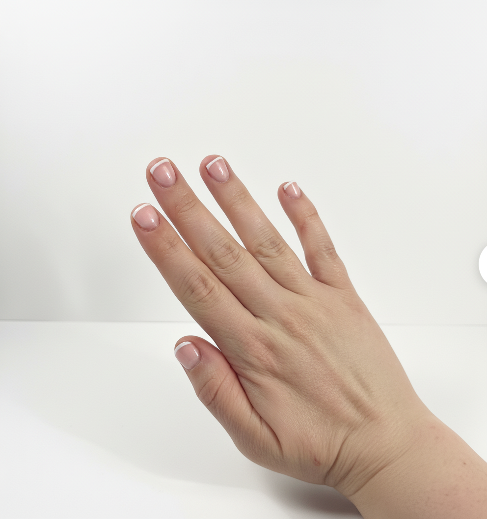 Retouched nail photo with corrected colour and smoothed skin